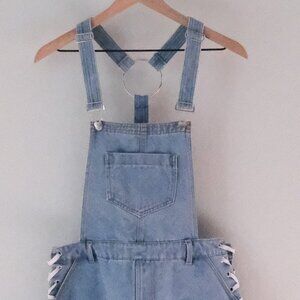 Denim shorts overalls with side ribbons.